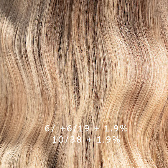 Close-up of blonde hair that’s been colored using the formula that’s overlayed on this image.