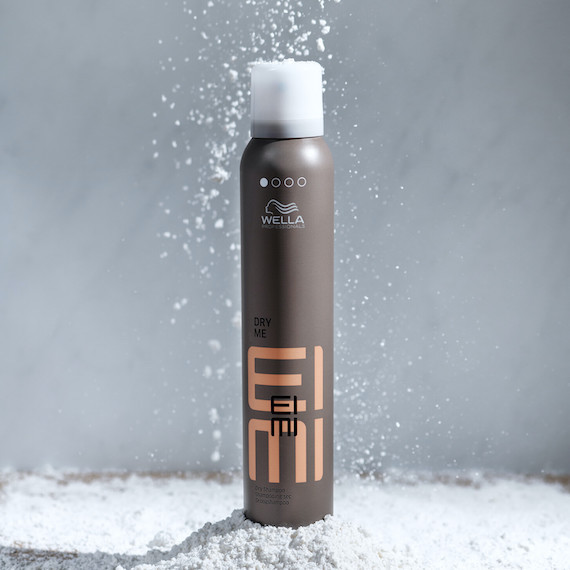 A can of EIMI Dry Me Dry Shampoo.