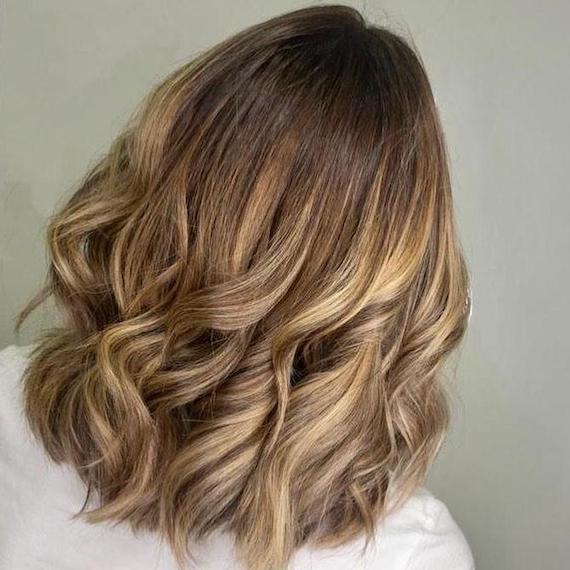 Back of woman’s head with bronde hair and balayage, created using Wella Professionals.