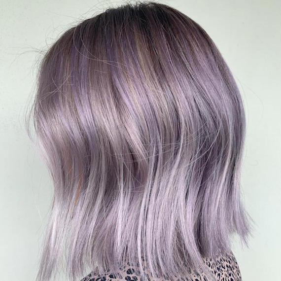 Close-up of shoulder-length lilac gray-colored hair