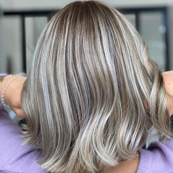 Back of woman’s head with bob haircut and chunky mushroom blonde highlights, created using Wella Professionals.