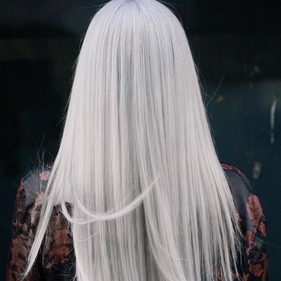 ‘After’ shot showing back of model’s head with long, straight, nordic blonde hair. 