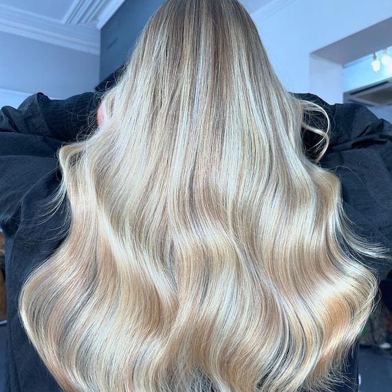 Model with long, loosely tousled, butter blonde hair.