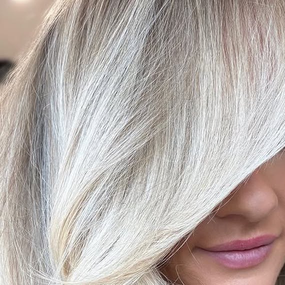 Close-up of model’s old money platinum blonde hair.