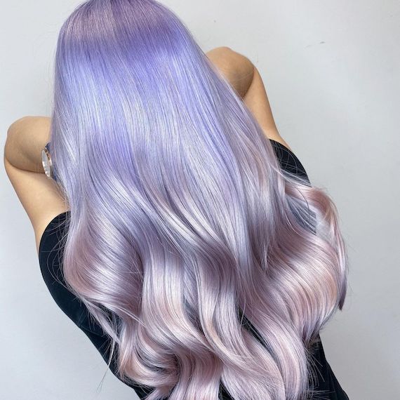 Back of model’s head with long, glossy, lilac and pink ombre hair.