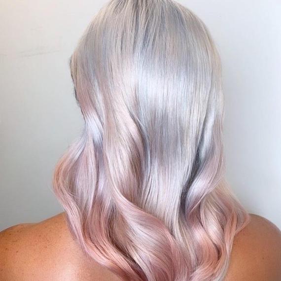 Back of woman’s head with silver blonde hair and pastel pink tips, created using Wella Professionals.