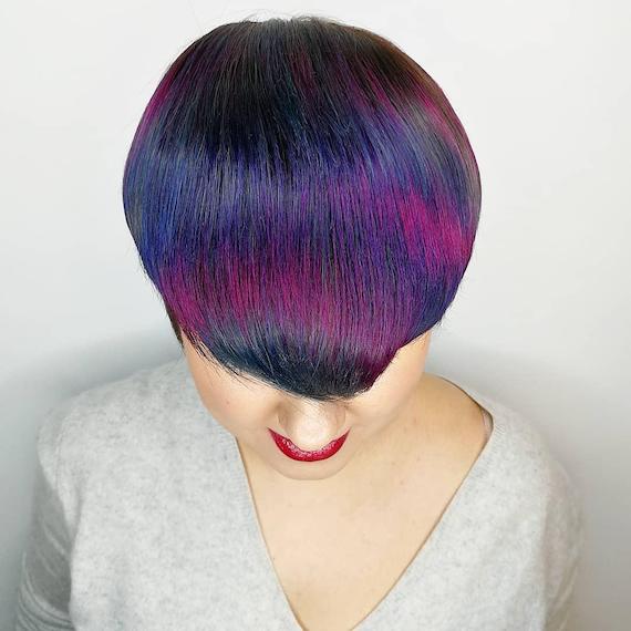 Photo of woman with pixie crop and peacock hair color, created using Wella Professionals.