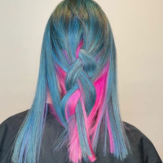 Back of model’s head with bright blue and hot pink hair.
