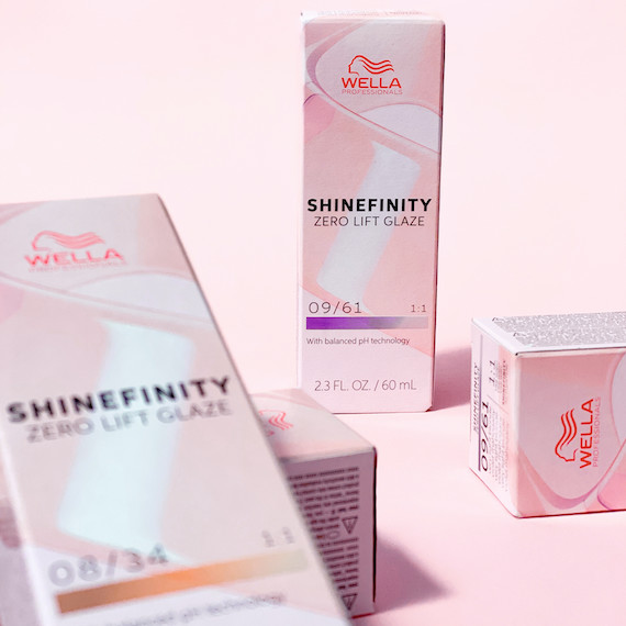 Boxes of SHINEFINITY Color Glaze on a pink background.