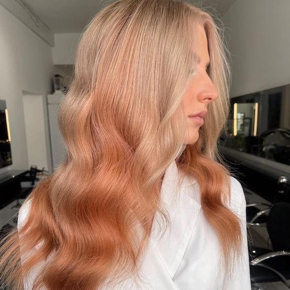 Side profile of model with blonde reverse ombre hair