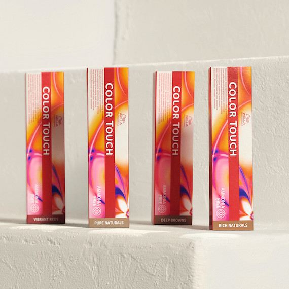 A row of Color Touch demi-permanent hair color boxes in a row on a white surface.