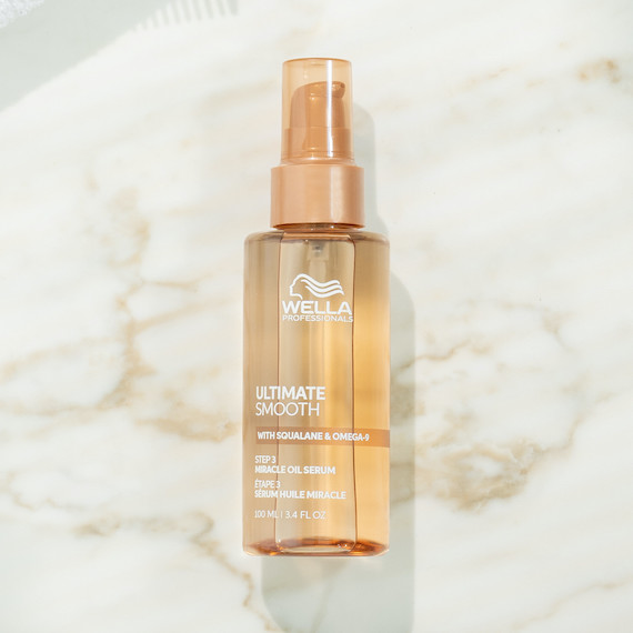 ULTIMATE SMOOTH Miracle Oil Serum on a marble surface.