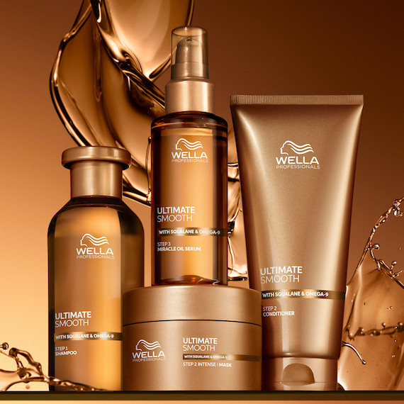 ULTIMATE SMOOTH Shampoo, Mask, Miracle Oil Serum and Conditioner on a golden background.