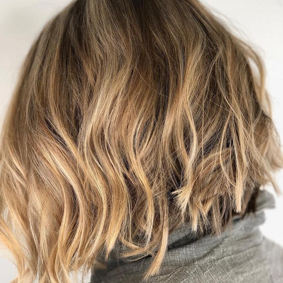 Back of woman’s head showing a bob with balayage swept through, created using Wella Pro-fessionals.