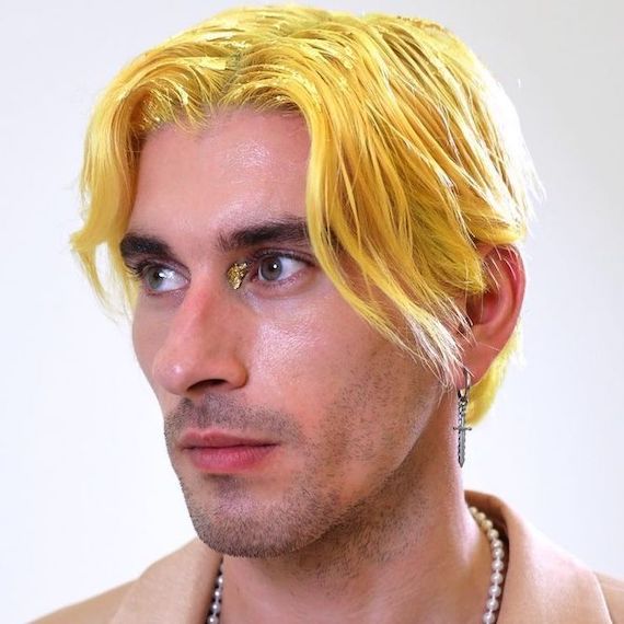 Model with a yellow curtain hairstyle.