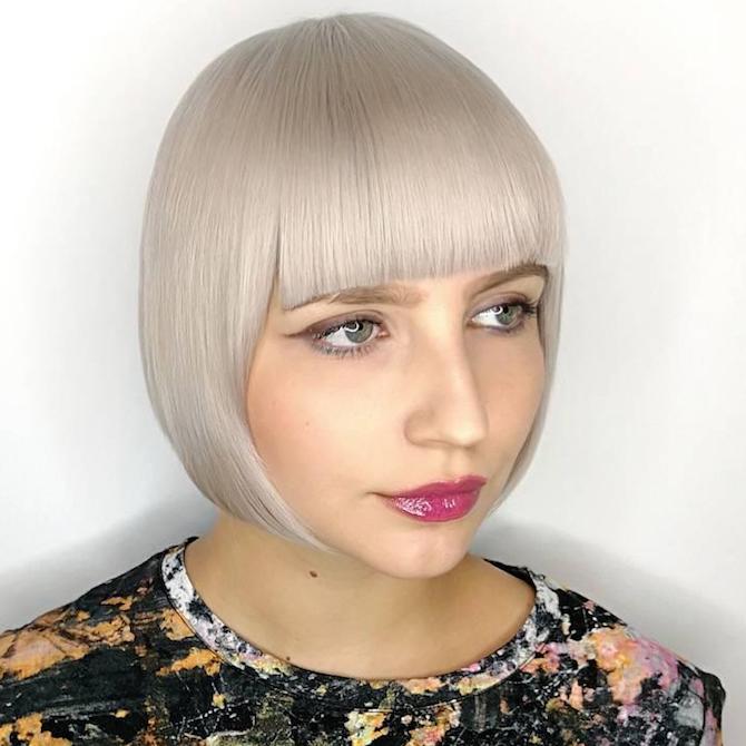 Photo of woman with short, blonde, blunt bob and bangs, created using Wella Professionals