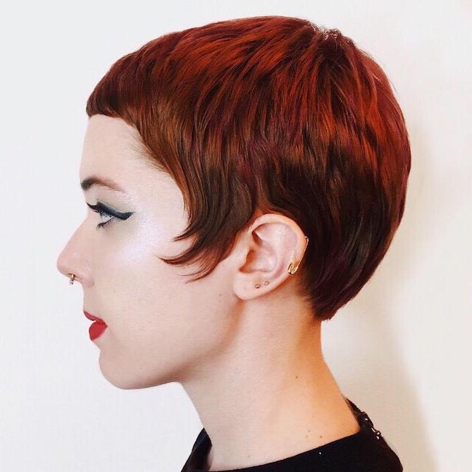 Side profile shot of woman with long pixie cut hairstyle, created using Wella Professionals