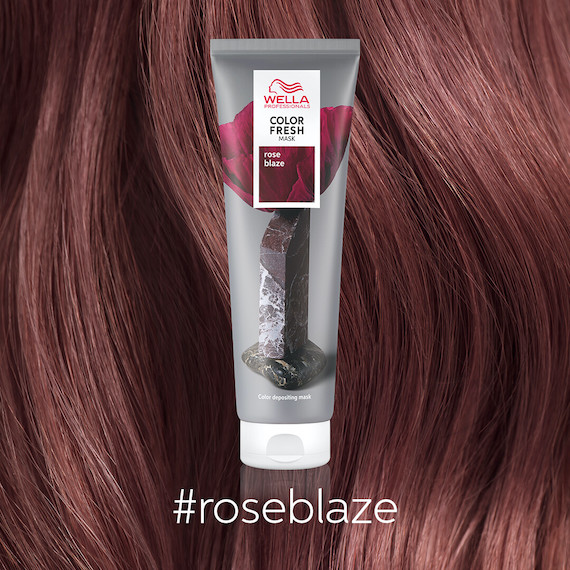 Tube of Color Fresh Mask in Rose Blaze appears in front of strawberry brown hair. 