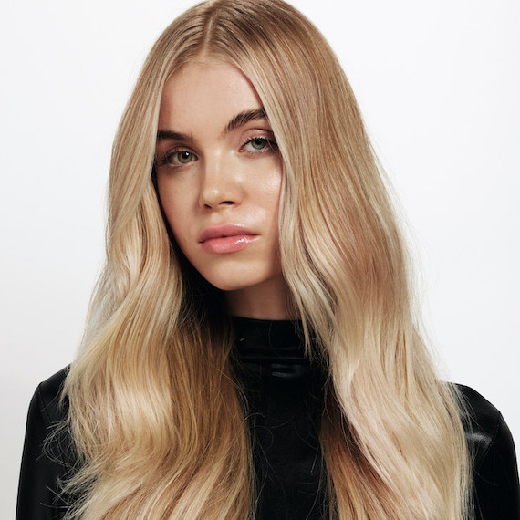 Model with long, loosely tousled, golden blonde hair.