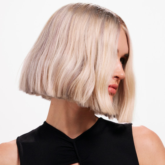 Model with platinum blonde bob haircut.