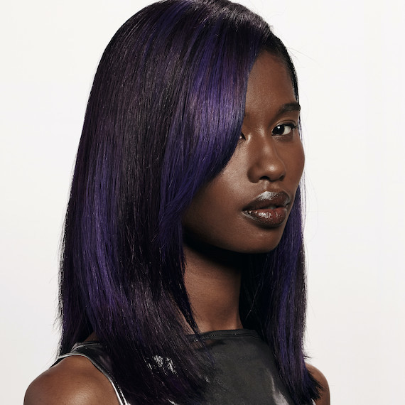 Model with dark brown hair featuring blocks of violet colour.