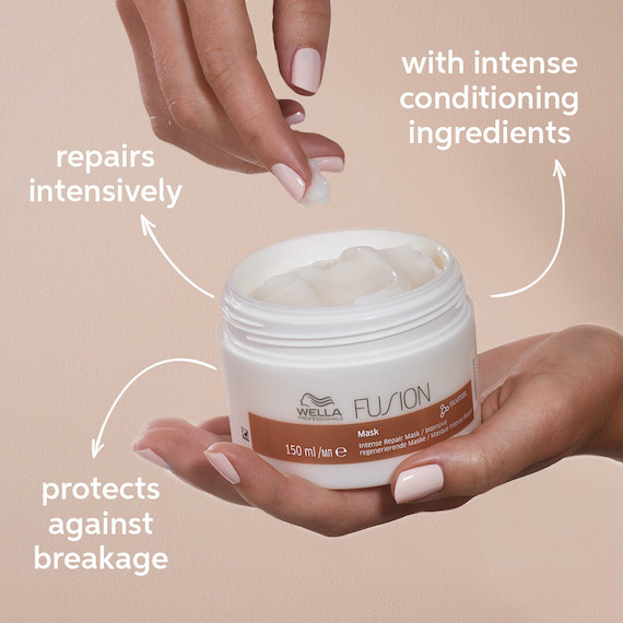Model’s hand holds a pot of Wella Professional’ Fusion Intense Repair Mask with arrows detailing the benefits.