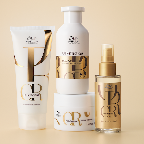 Oil Reflections Shampoo, Conditioner, Mask and Luminous Smoothing Oil bottles sit side by side.