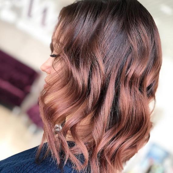 Photo of woman’s hair with rose brown hair color. Look created by Wella Professionals.