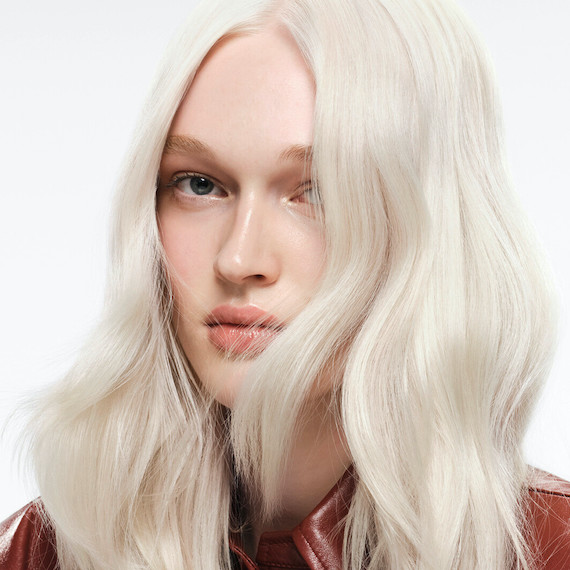 Model with long, loosely tousled, platinum blonde hair.