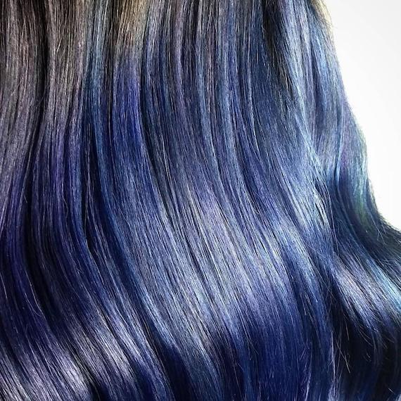 Close-up of wavy, blue-black hair, created using Wella Professionals