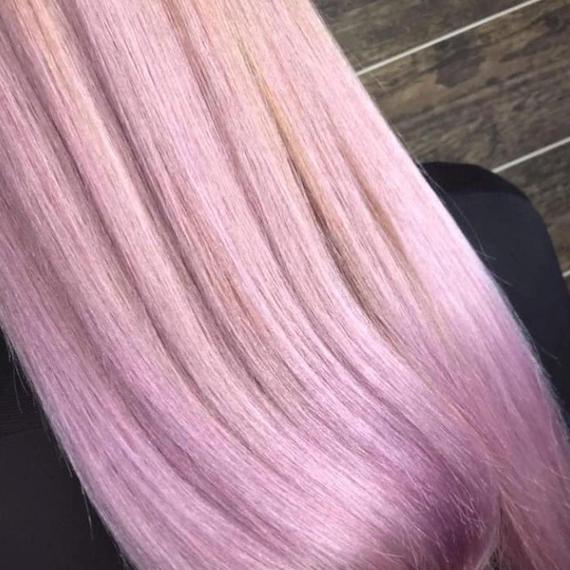 Close-up of metallic pastel pink hair, created using Wella Professionals