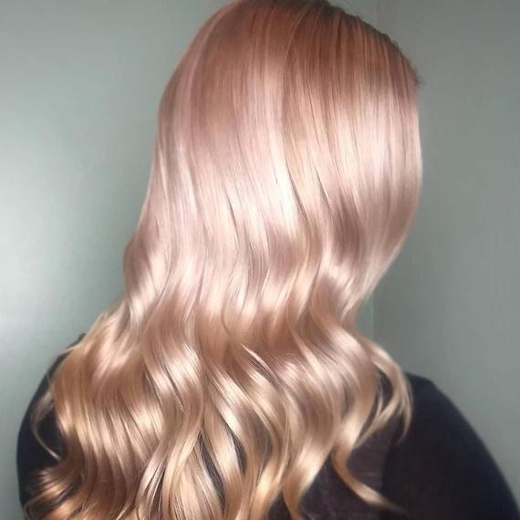 Model with long, pale pink-colored hair, created using Wella Professionals