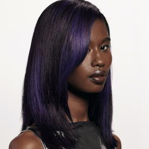Dark brown hair featuring bold violet highlights.
