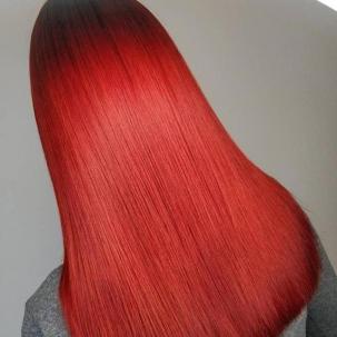 Photo of long, straight, cherry red hair, created using Wella Professionals.