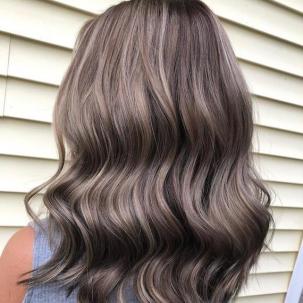 Back of woman’s head with ash brown and gray hair, created using Wella Professionals.