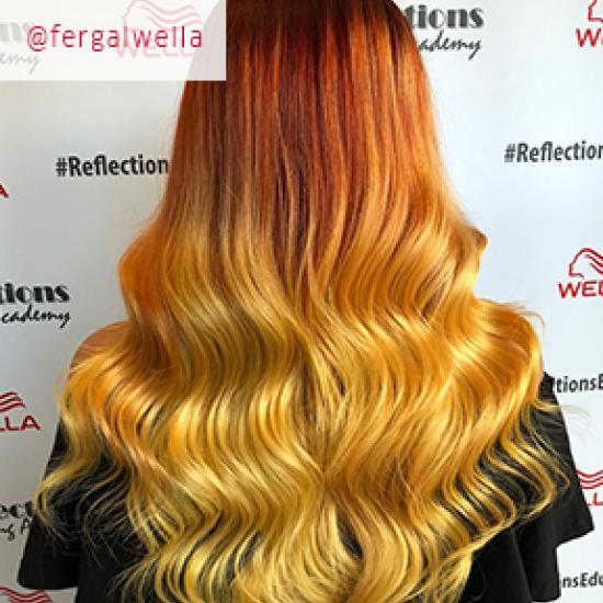 Model with ombre hair in orange and yellow tones