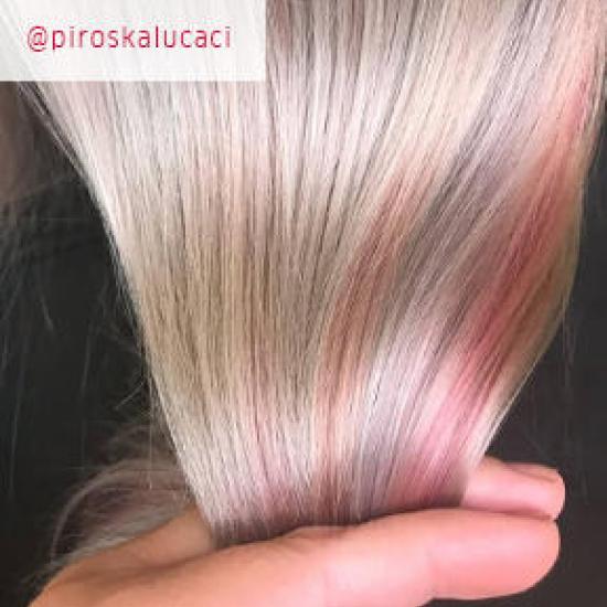 Woman with long metallic hair, created using Wella Professionals