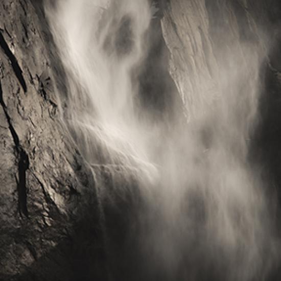 Mist falling down a rock face