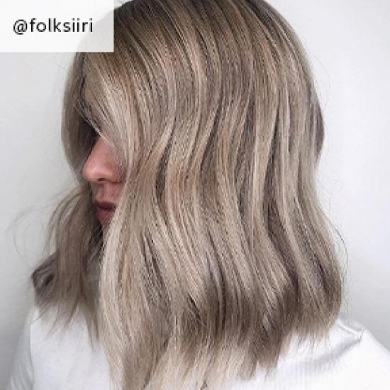 Wavy ash blonde hair, created using Wella Professionals