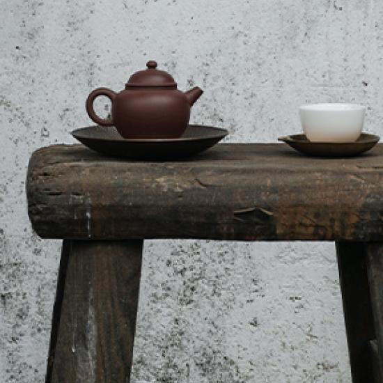 pot of tea on wooden table 