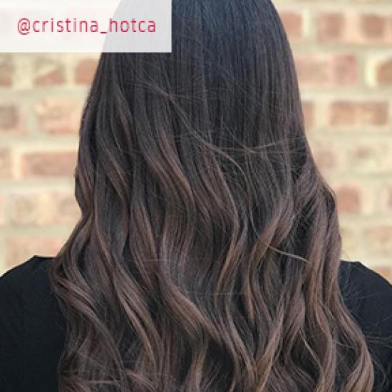 Back of woman’s head with long,dark ash brown hair 