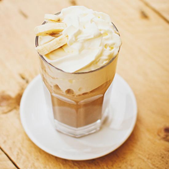 Coffee with cream and banana on top