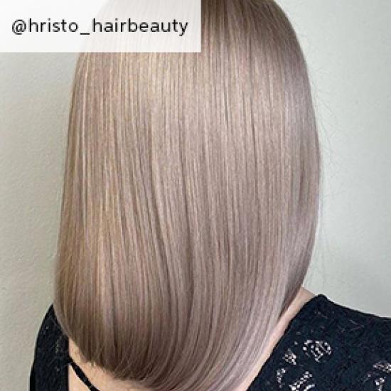 Back of woman’s head with dirty blonde hair, created using Wella Professionals.