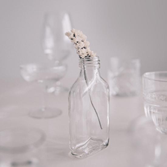 Image of a bottle and drinking glasses