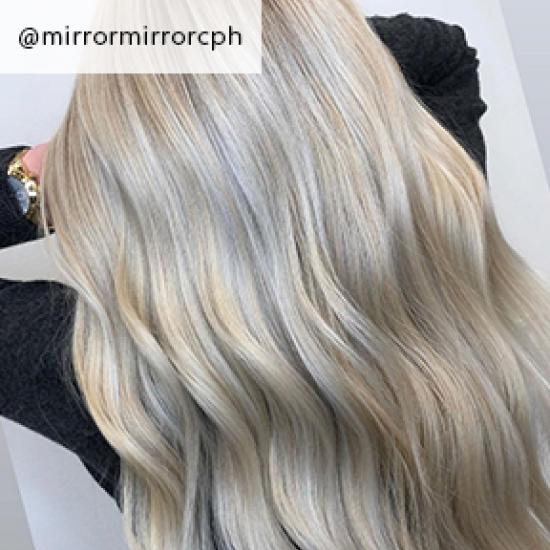 Back of wavy mother of pearl hair, created using Wella Professionals