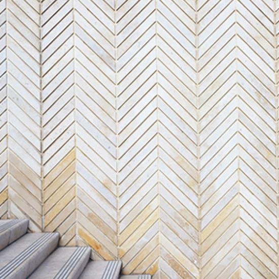 Image of stairs and angled cream tiles 