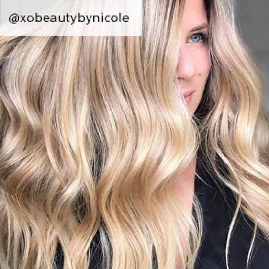 Photo of woman with wavy sandy blonde hair, created using Wella Professionals.