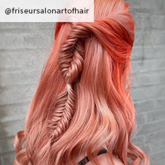 Image of dark pink hair with plait