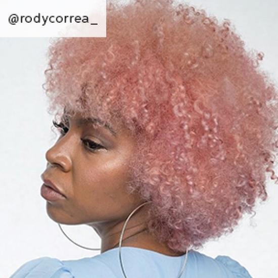 Image of side of short curly cotton candy hair, created using Wella Professionals