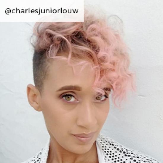 Image of side of short curly cotton candy hair, created using Wella Professionals